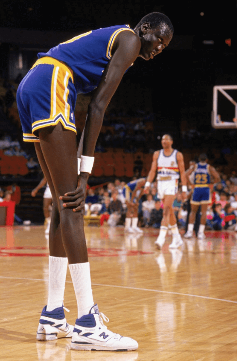 Manute Bol taking a breather.
