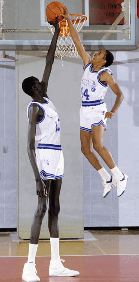 Spudd Webb rejecting teammate Manute Bol.